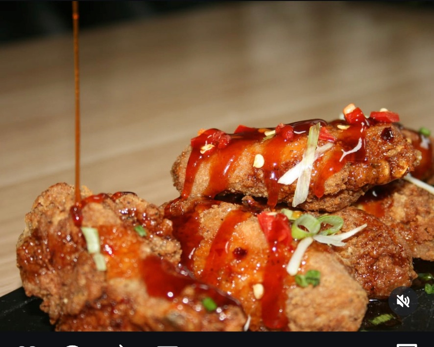 Signature sauce wings glazed and topped with sesame, chilli and spring onion